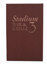 Football material with die-cut logo and solid copper background.